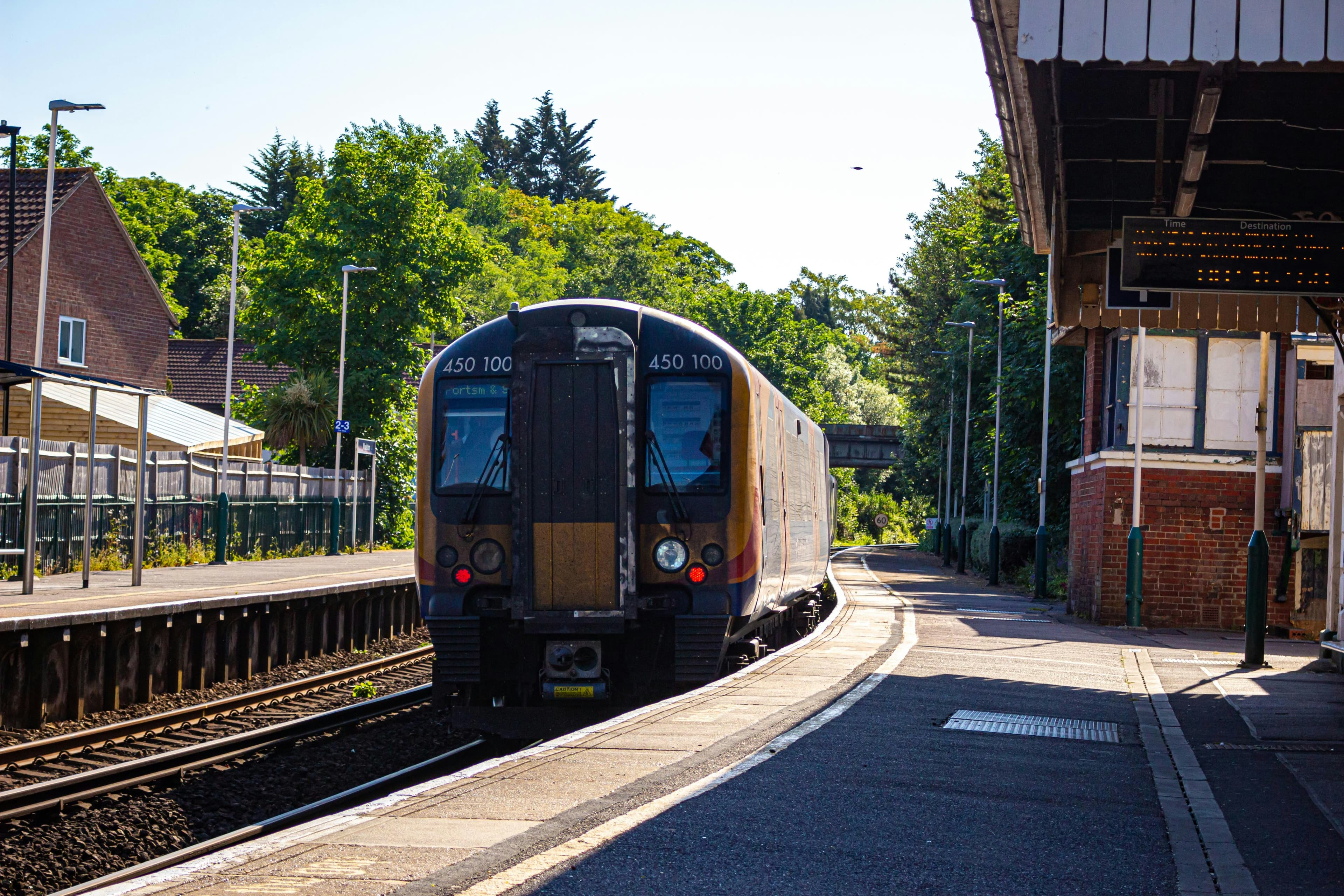 UK train arriving at station platform