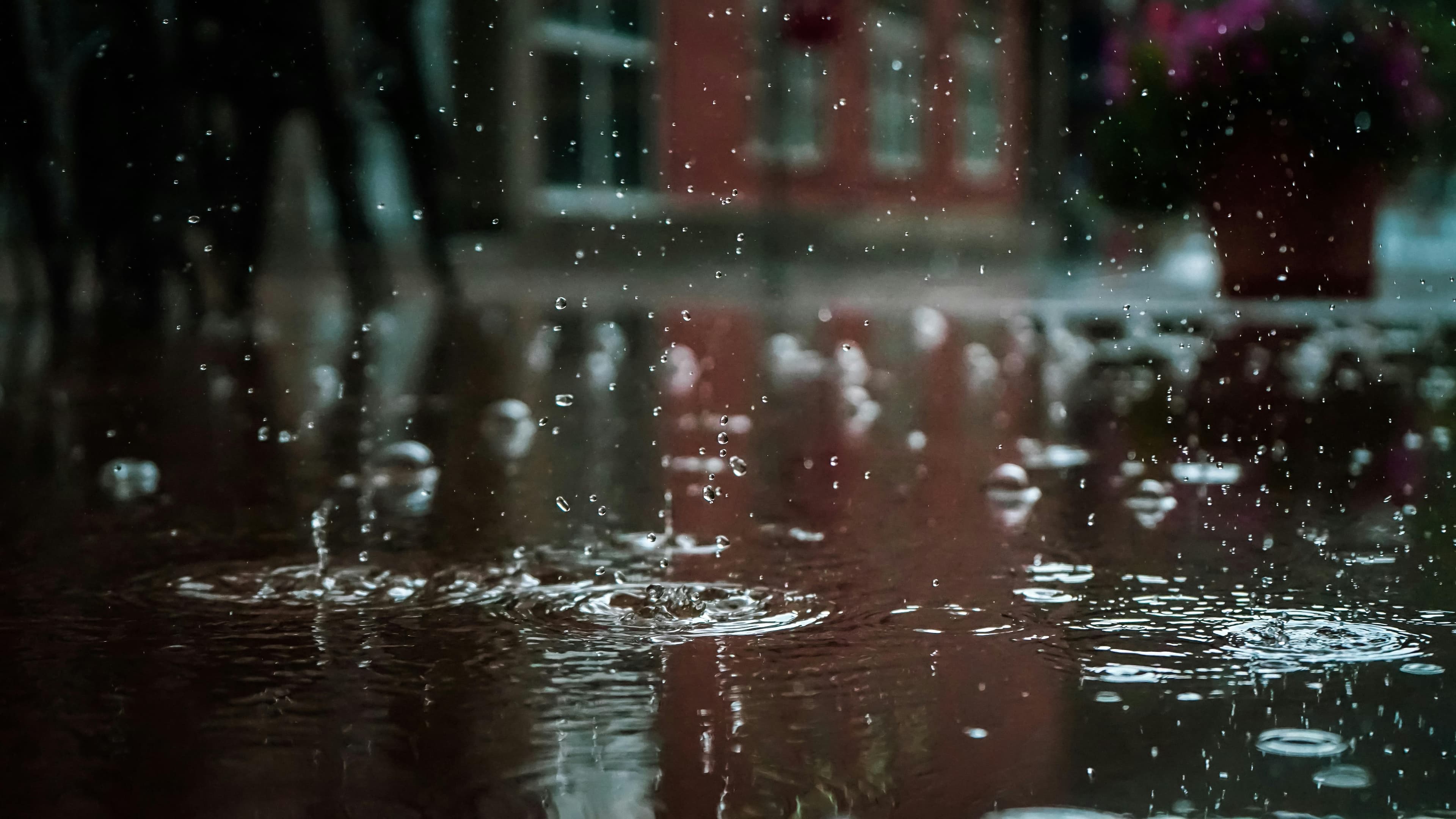 Flooded city street in heavy rain